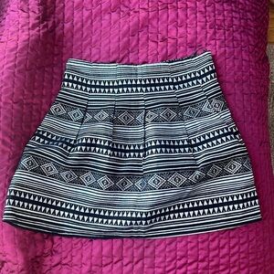 Metallic silver and black pleaded skirt